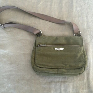 Kipling moss green with colbalt blue lining crossbody bag